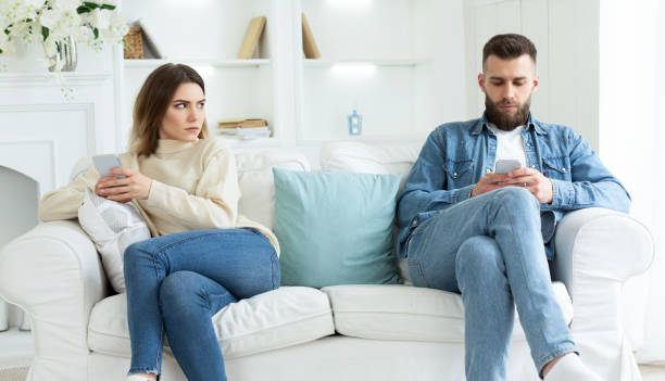 istock Couple Crisis. Man Using Phone, Not Paying Attention To Wife 2194372865