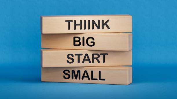 istock Think big start small symbol. Concept words Think big start small on wooden blocks.Business and Think big start small concept. Copy space.3D rendering on blue background. 2194377555