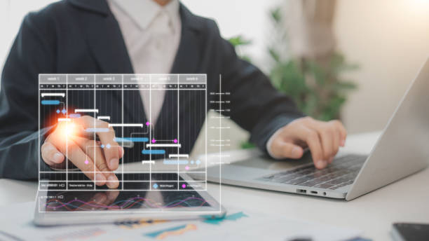 istock The project manager works and updates tasks with milestones and progress planning. Businessman draw Gantt chart scheduling virtual diagram, project management concept 2194377634