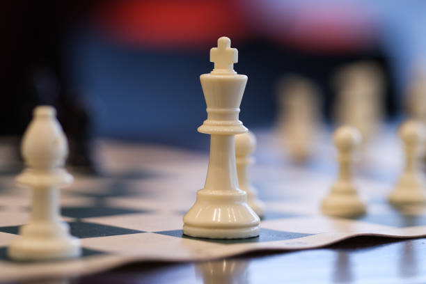 istock Chess pieces with a king in focus 2194378566