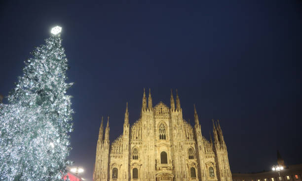 istock milan cathedral s gothic facade shines bright with festive christmas tree and glowing snowflake 2194380787