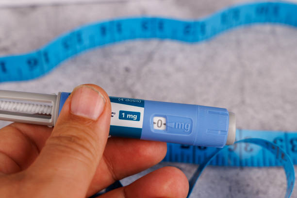 istock Diabetes pens with semaglutide held by hand and placed on cement surface. 2194381222