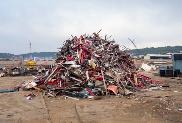 Scrap, metal and aluminium pressed together i a pile of metal junk