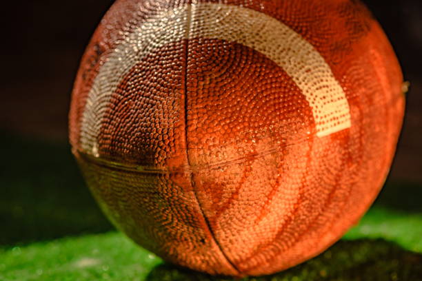 istock American football ball texture as background 2194381514