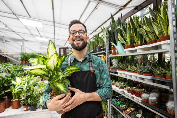istock Young Florist Posing Proudly with Plants 2194381962