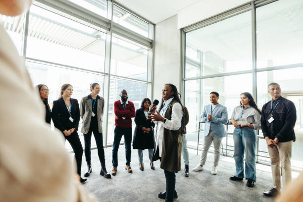istock Leader addressing a crowd at a seminar in a modern office space 2194382792