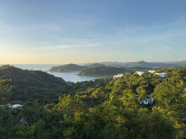 istock Tranquil mountain view with lush greenery and serene water during sunset 2194383024