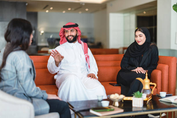 istock Diverse Arabic Business Executives Engaging in Modern Hotel Lobby Meeting 2194383571