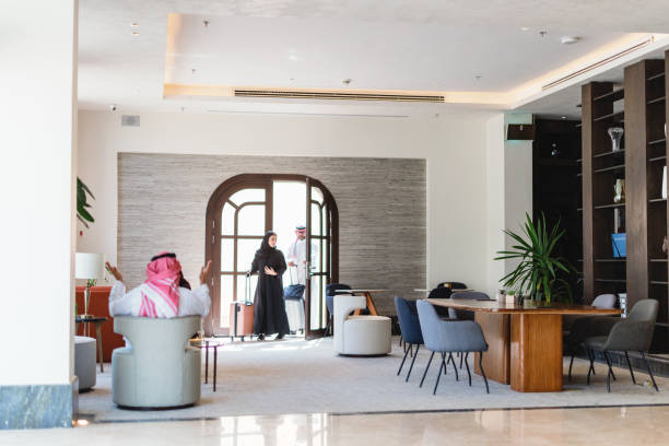 istock Happy Middle Eastern Couple Entering Modern Hotel Lobby 2194383708