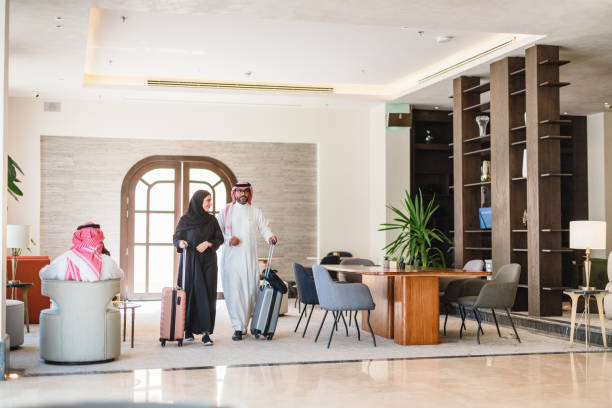 istock Cheerful Arabic Couple Arriving at Modern Hotel Lobby 2194383709