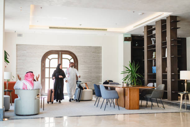 istock Joyful Arabic Couple Arriving at Modern Hotel Lobby 2194383715