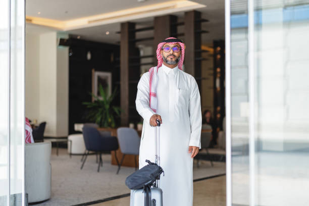 istock Confident Middle Eastern Businessman Exiting Modern Hotel Lobby 2194383740