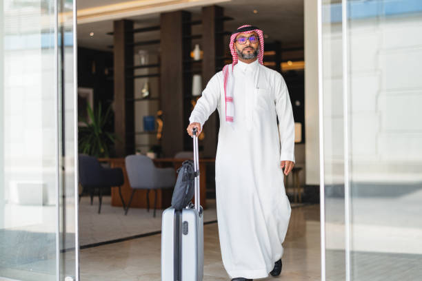 istock Confident Middle-Aged Arabic Businessman Exiting Modern Hotel 2194383746