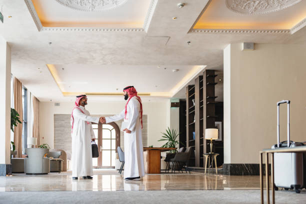 istock Confident Arabic Businessmen Shaking Hands in Elegant Hotel Lobby 2194383805
