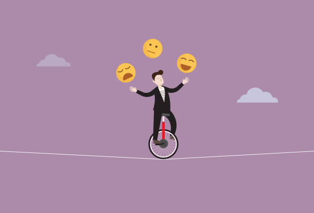 istock businessman control emotion by riding a unicycle and juggling emoji icon for emotional Intelligence mental health concept 2194385014