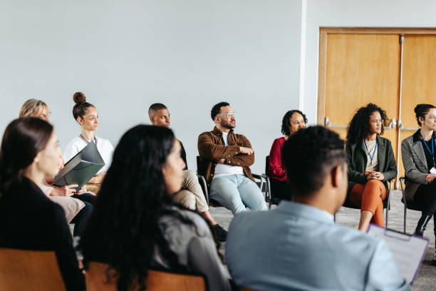 istock Diverse group of professionals attentively participating in a corporate workshop 2194385609