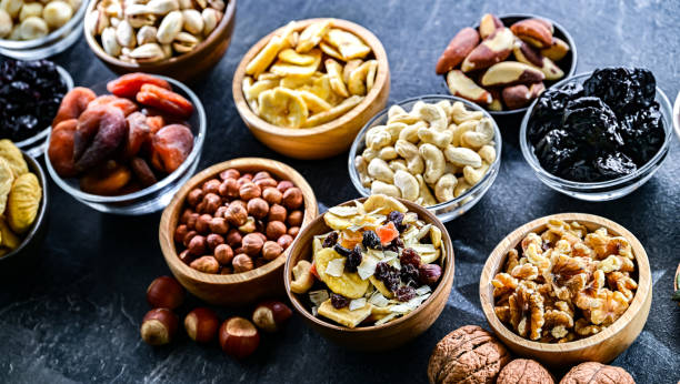 istock Composition with a variety of dried fruits and assorted nuts. 2194386474