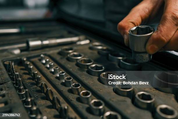 Hand Selecting A Metal Socket Wrench Piece From An Organized Tool Tray In A Workshop Setting Symbolizing Precision And Automotive Repair-foton och fler bilder på Organisation