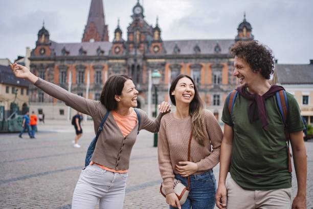 istock Tourists visiting malmo city hall having fun and laughing 2194388518