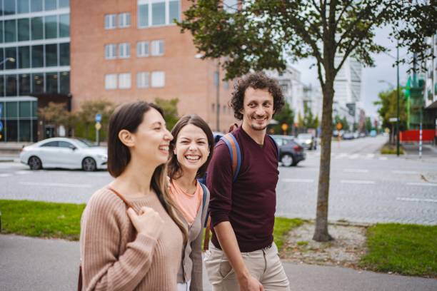 istock Three young adults walking and laughing in malmo city 2194388591