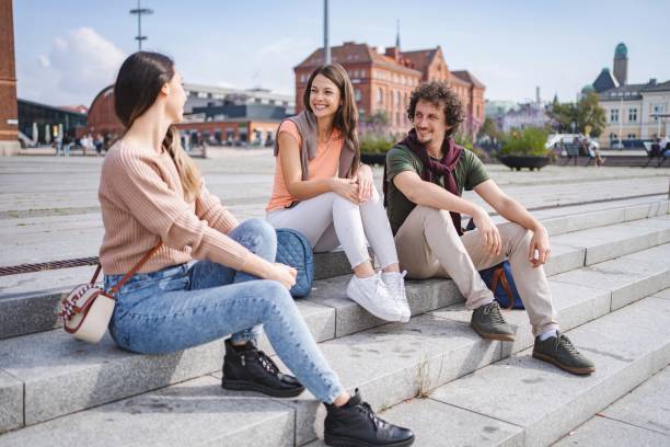 istock Students relaxing and chatting on steps in malmo, sweden 2194388976