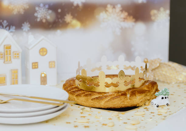 istock Almond royal galette with crown on the table in the kitchen. 2194389875