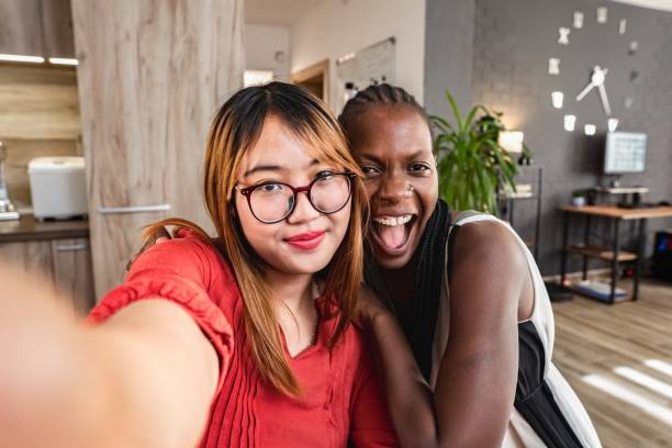 istock Two young women taking a selfie at home 2194391106