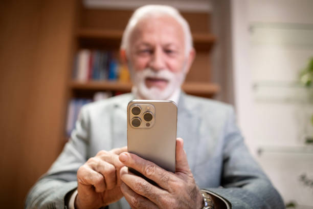 istock Senior businessman using smart phone. 2194391210
