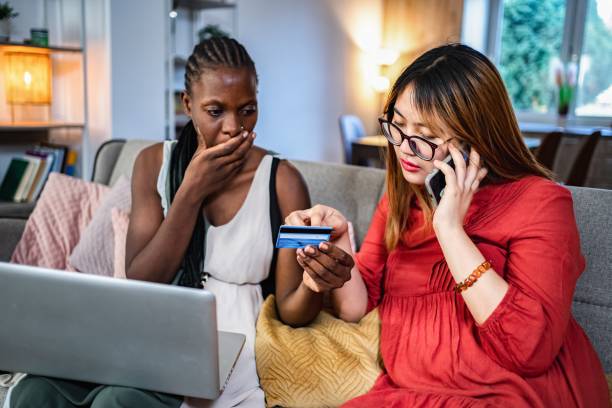 istock Two worried women calling customer service after online problems with credit card 2194391261
