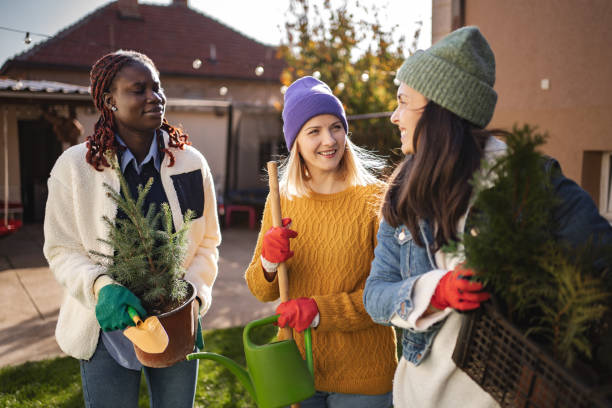 istock Three young women gardening together in backyard 2194391357