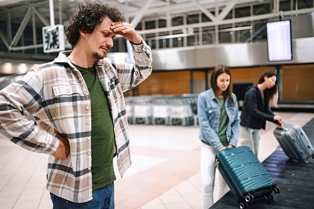istock Stressed tourist having headache at the airport while waiting for flight 2194391711
