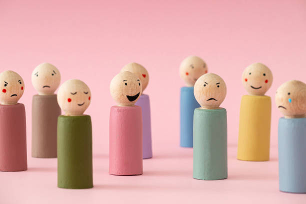 istock Image of different emotions on wooden peg dolls against pink background. 2194391737
