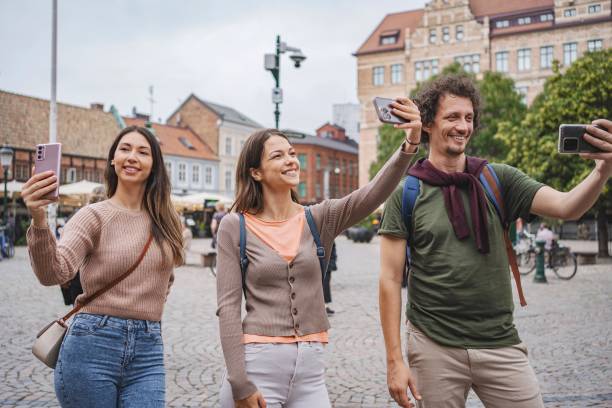 istock Tourists taking selfies in malmo, sweden, enjoying vacation 2194391846