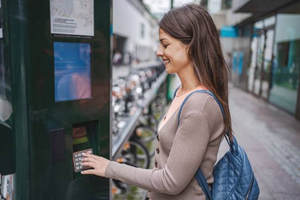 istock Young woman renting a bicycle in malmo, sweden, using a self-service terminal 2194391873