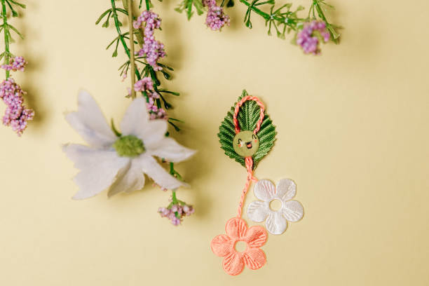 istock One beautiful floral martisor with spring flowers on a yellow background. 2194392547