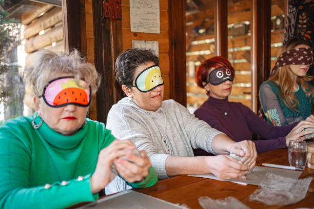 Therapists guiding patients in sensory exploration during group therapy session