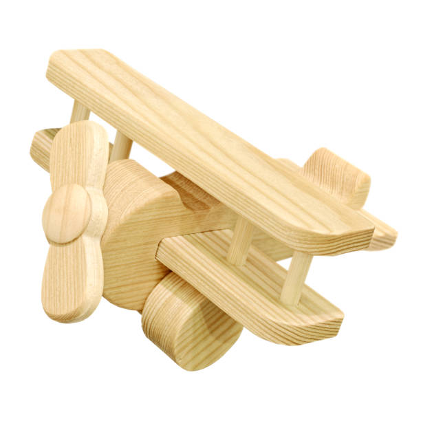 Wooden toy airplane and mini globe on white background