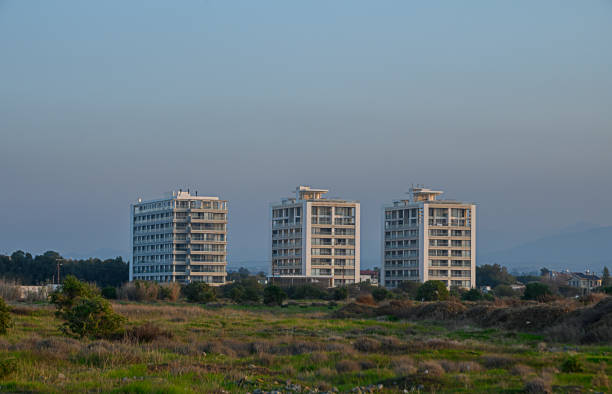 istock Modern buildings rise above serene landscape under a soft evening sky 2194395117