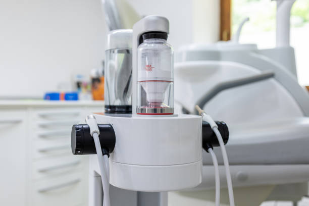 Air Flow dental cleaning system with powder and water containers, designed for professional teeth cleaning and oral hygiene in a clinical setting
