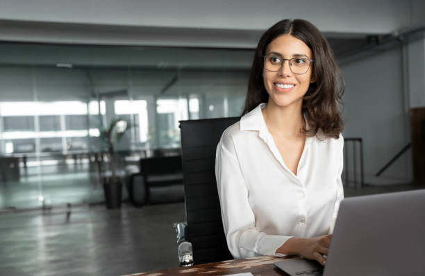 istock Young professional it specialist latin hispanic business programmer lady working on laptop pc sitting at desk in office. 30s middle eastern indian woman using computer technology app for work online 2194397192