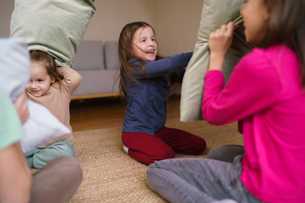 istock Kids having fun in pillow fight 2194399242