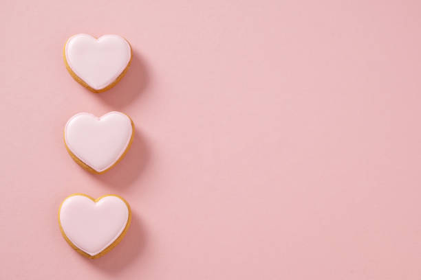 istock Heart shaped pink cookie on girly pastel background. Valentines day card. 2194399271