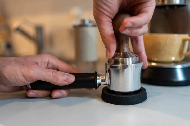 istock Tamping Ground Coffee: Essential Step in Espresso Brewing 2194401454