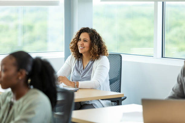 istock Smiling Woman in a Group Therapy Session 2194401478