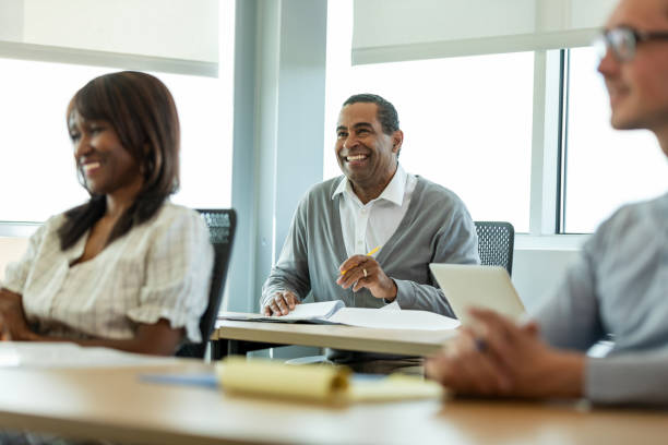 istock Diverse Group of Adults in a Classroom Setting 2194401509
