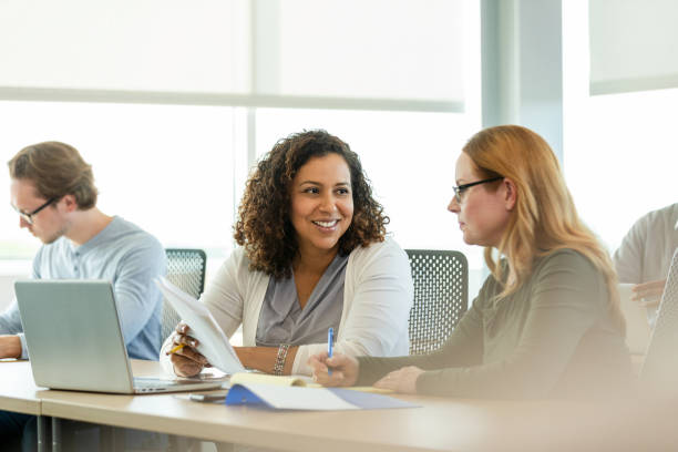 istock Two Diverse Women in Discussion,  Collaboration and Teamwork 2194401542