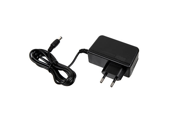 A black power adapter with a European plug and a coiled cable, designed for electronic devices, highlighting its practical and functional design.