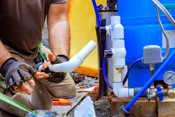 istock Plumber assembling connection for water well to a household water system 2194404135