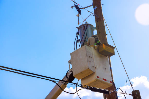 istock Technician works safely from bucket lift to install service electrical equipment attached to a tall pole. 2194404166