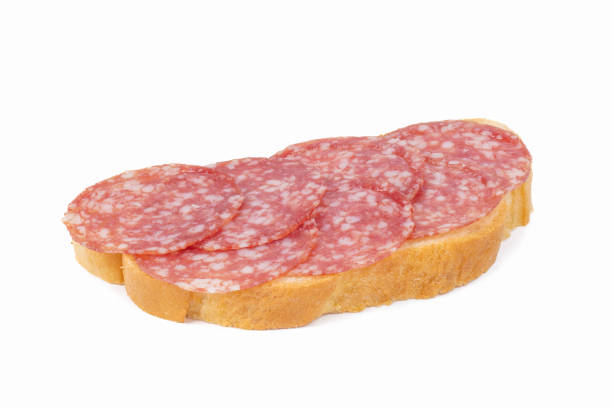 istock slice of bread with salami isolated on white background 2194405072